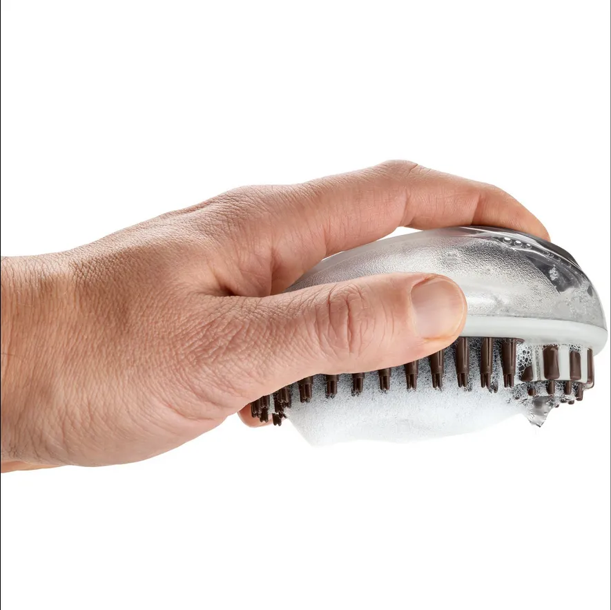 Cepillo maseajeador con aplicador de champú 